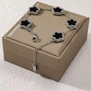 Elegant Black and Silver onyx clover with cubic zirconia Bracelet